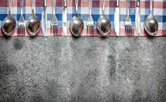 Serving background. Cutlery on a napkin. photo