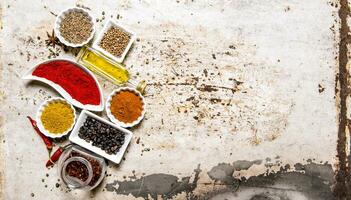 Set of colorful spices and herbs. On rustic background. photo