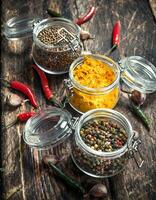 Various spices in glass jars. photo