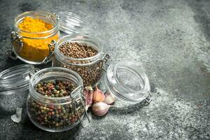 Spices in glass jars. photo