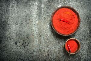 Ground red pepper in a bowl. photo