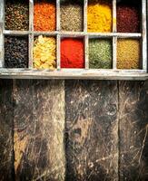 Different spices and herbs in a box. photo