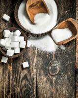 Sugar with a scoop in a bowl. photo