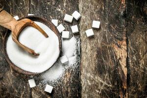 Sugar with a scoop in a bowl. photo