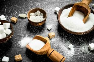 Sugar in a bowl with a scoop. photo