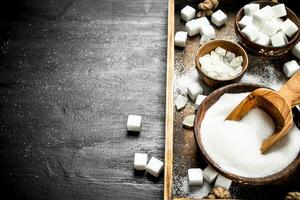 Sugar on an old wooden tray. photo