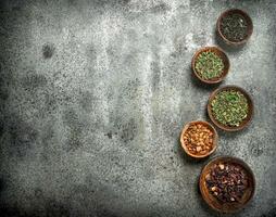 Different kinds of fragrant tea in bowls. photo