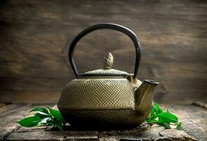 Teapot with fragrant Indian tea. photo