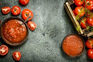 Tomato sauce with spices and garlic in a bowl. photo