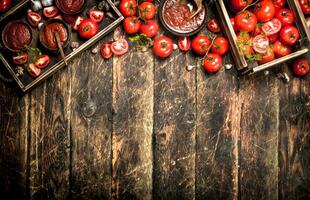 Tomato sauce with spices and garlic in the old tray. photo