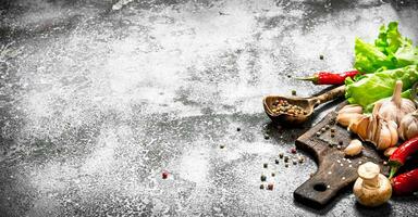 Fresh vegetables . Fresh vegetables with spices and herbs. On rustic background. photo