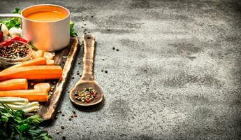 Fresh vegetables . Fresh Vegetables with spices, herbs and carrot juice. On rustic background. photo