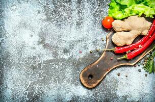 Fresh vegetables . Fresh vegetables with spices and herbs. On rustic background. photo