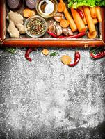 Fresh vegetables . fresh vegetables and herbs in the old tray. On rustic background. photo