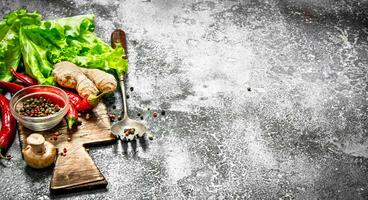 Fresh vegetables . Fresh vegetables with spices and herbs. On rustic background. photo