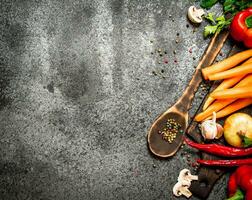 Fresh vegetables . Fresh vegetables with spices and herbs. On rustic background. photo