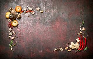 Fresh spices. Frame from a variety of aromatic spices. On rustic background. photo