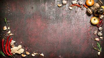 Fresh spices. Frame from a variety of aromatic spices. On rustic background. photo