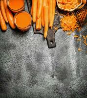 Fresh carrot juice. On rustic background. photo