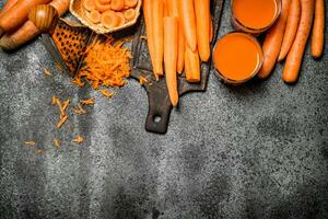 Fresh carrot juice. On rustic background. photo