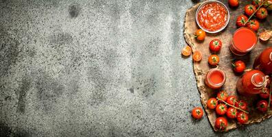 Fresh tomatoes, tomato juice and sauce. photo