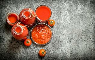 Fresh tomatoes, tomato juice and sauce. photo