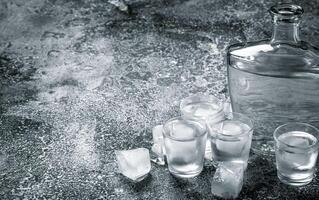 Vodka with ice in glasses. photo