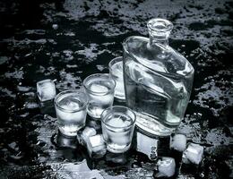 Vodka shots with ice. photo