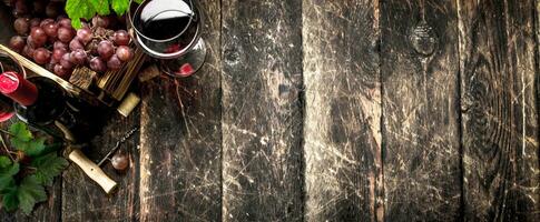 Wine background. Red wine with a box of grapes. photo