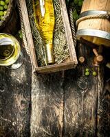 Wine background. White wine with a bucket of green grapes. photo