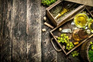 White wine with fresh grapes on an old tray. photo