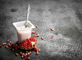 Yogurt with fresh pomegranate. photo