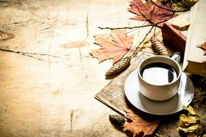 Autumn style. Coffee with an old books. photo