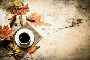 Autumn style. Coffee with an old books. photo