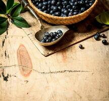 Blueberries in cup with a spoon. photo