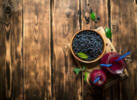 Blueberry juice . On wooden table. photo