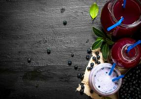 Blueberry smoothies and fresh juice on the old fabric. photo
