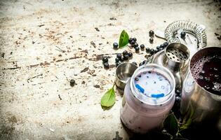 Blueberry smoothies and fresh cocktails. On old rustic background. photo