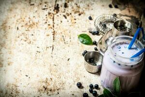 fresh cocktail of blueberry milk. On old rustic background. photo