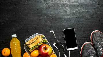 Orange juice with sandwiches and fruit. photo