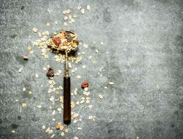 Fitness food. Cereal and dried fruits in spoon. photo