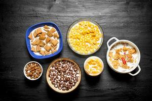 Different cereals with milk. photo