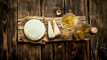 Sheep cheese with white wine and walnuts. photo