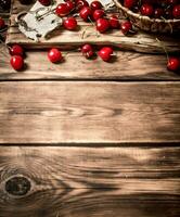 Cherry in a basket on the Board photo