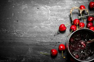 Cherry jam in a saucepan. photo