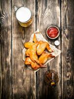 Smoked chicken wings with beer photo