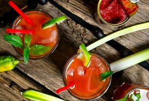 Making cocktail with ingredients on wooden background . photo