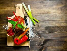 Making cocktail with ingredients on wooden background . Free space for text. photo