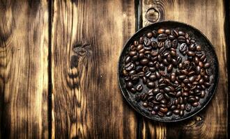 Fresh roasted coffee in the pan. photo