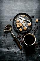 Fresh coffee. Coffee cup with brown sugar and roasted grains . photo